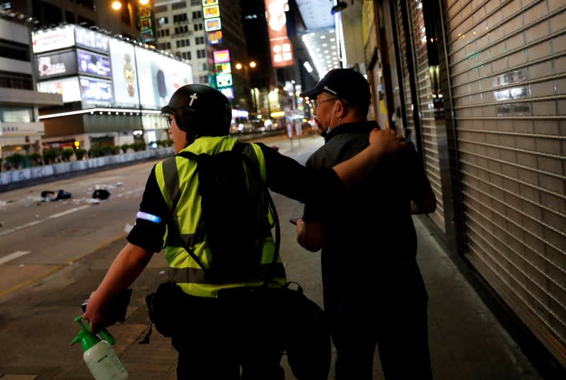 The Wider Image: Sermons with saline: Hong Kong pastor offers aid and prayers