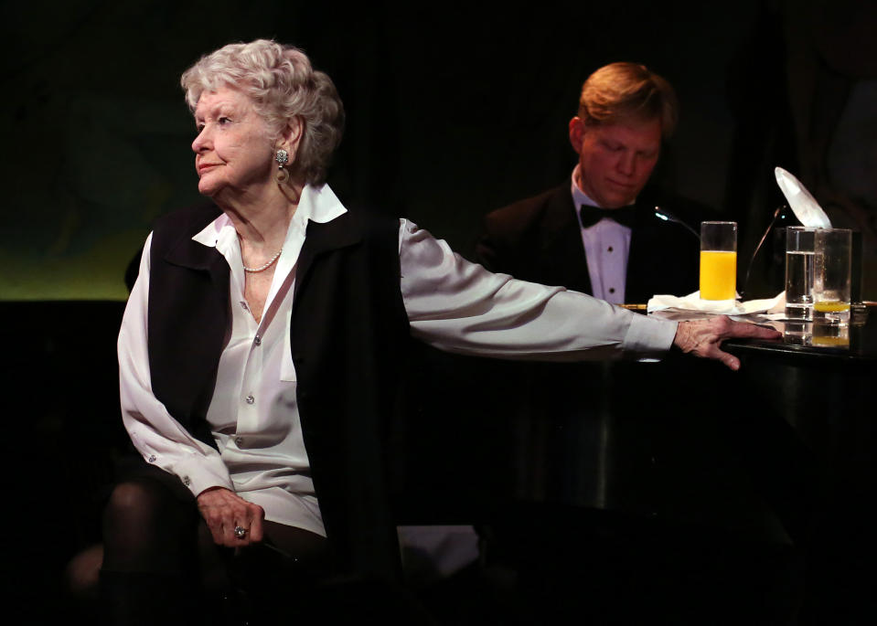 This April 2, 2013 image released by the O+M Company shows Elaine Stritch performing her final engagement at the Cafe Carlyle in New York with Rob Bowman at the piano. Stritch kicked off a final series of concerts to bid farewell to New York on Tuesday, refusing to be maudlin and instead weaving her typical brand of sass and feistiness. Stritch plans to retire to Birmingham, Mich. a suburb of Detroit, after seven decades in New York City. She ends her five-show farewell on Saturday. (AP Photo/The O+M Company, Walter McBride)