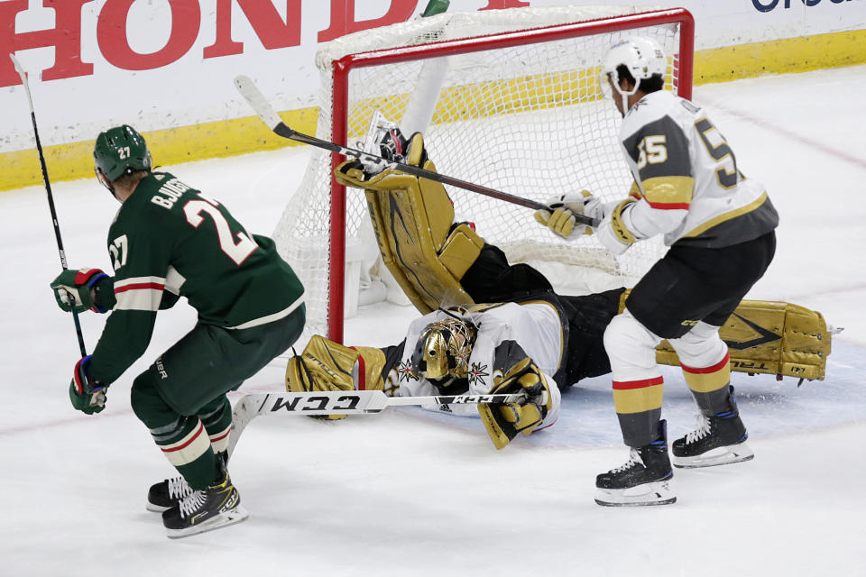 Minnesota Wild center Nick Bjugstad (27) scores a goal on Vegas Golden Knights goaltender Marc-Andre Fleury (29) during the third period in Game 6 of an NHL hockey Stanley Cup first-round playoff series Wednesday, May 26, 2021, in St. Paul, Minn. The Wild won 3-0. (AP Photo/Andy Clayton-King)