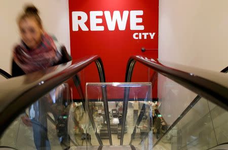 A customer leaves a German supermarket chain Rewe shop at Friedrichstrasse in Berlin, Germany March 17, 2016. REUTERS/Fabrizio Bensch