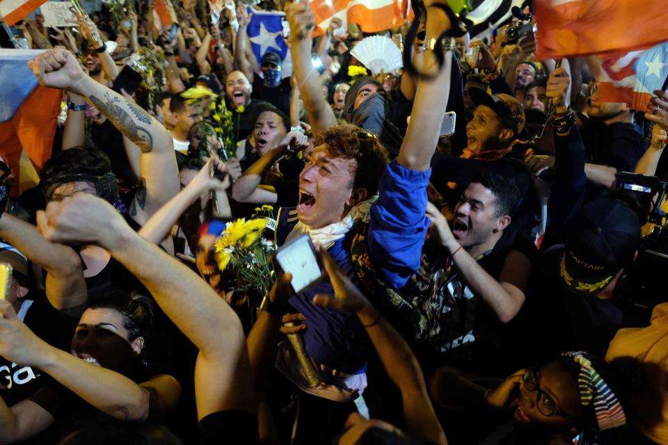 Demonstrators celebrate the resignation of the governor of Puerto Rico, Ricardo Rossello, in front of his mansion known as La Fortaleza in San Juan on July 24, 2019.