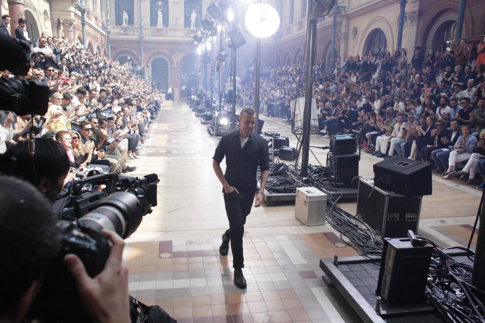 Dutch fashion designer Lucas Ossendrijver walks on the catwalk after the presentation of Lanvin's Spring-Summer 2014 men's collection, Sunday, June 30, 2013 in Paris. (AP Photo/Thibault Camus)