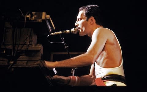 Freddie Mercury, lead singer of Queen during a concert at the Palais Omnisports de Paris Bercy - Credit: AFP