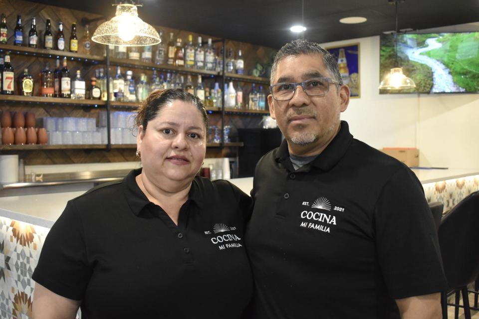 Norma Pavon (left) and Ricardo Pavon (right) stand inside their family restaurant Cocina Mi Famila, as seen, Thursday, March 14, in Sheboygan, Wis.