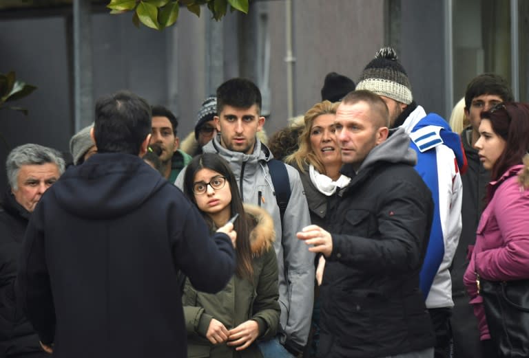 Family and friends wait for news as they gather outside the Pescara Central Hospital, in the eastern coastal city of Pescara on January 20, 2017