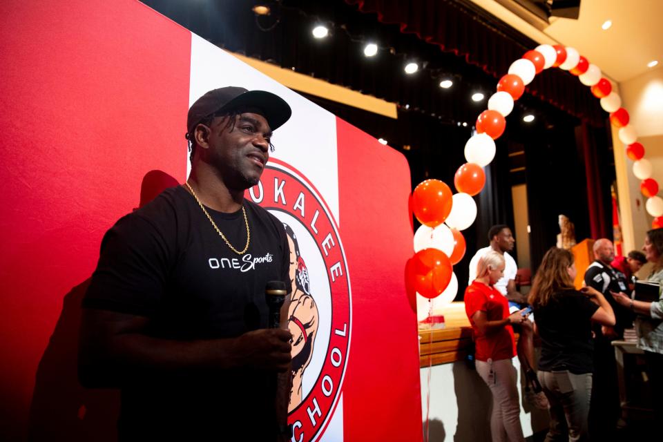 Former Immokalee football start Edgerrin James, a Pro Football Hall of Fame inductee, speaks with reporter during an event hosted alongside of Immokalee football alum J.C. Jackson, Bowl champion and Pro Bowl player, Monday, May 16, 2022, at Immokalee High School in Immokalee, Florida.Jackson and James signed autographs on helmets, books and gave advice to the students.