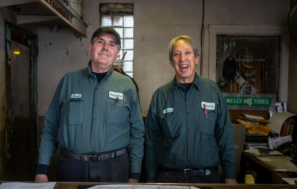 Paul Warholak, left, and Mike Warholak Jr. stand behind the counter inside Warholak Tire Service in Detroit on Tuesday, Oct. 31, 2023. After 92 years of serving the community, Warholak Tire Service has been sold and will be under new ownership.