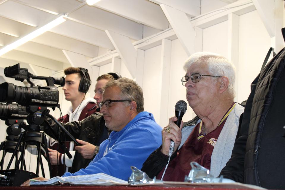 Ernie Mezey, with microphone, announcing the Oct. 14, 2022 game at Wayne Hills High School against Passaic Valley Hornets.