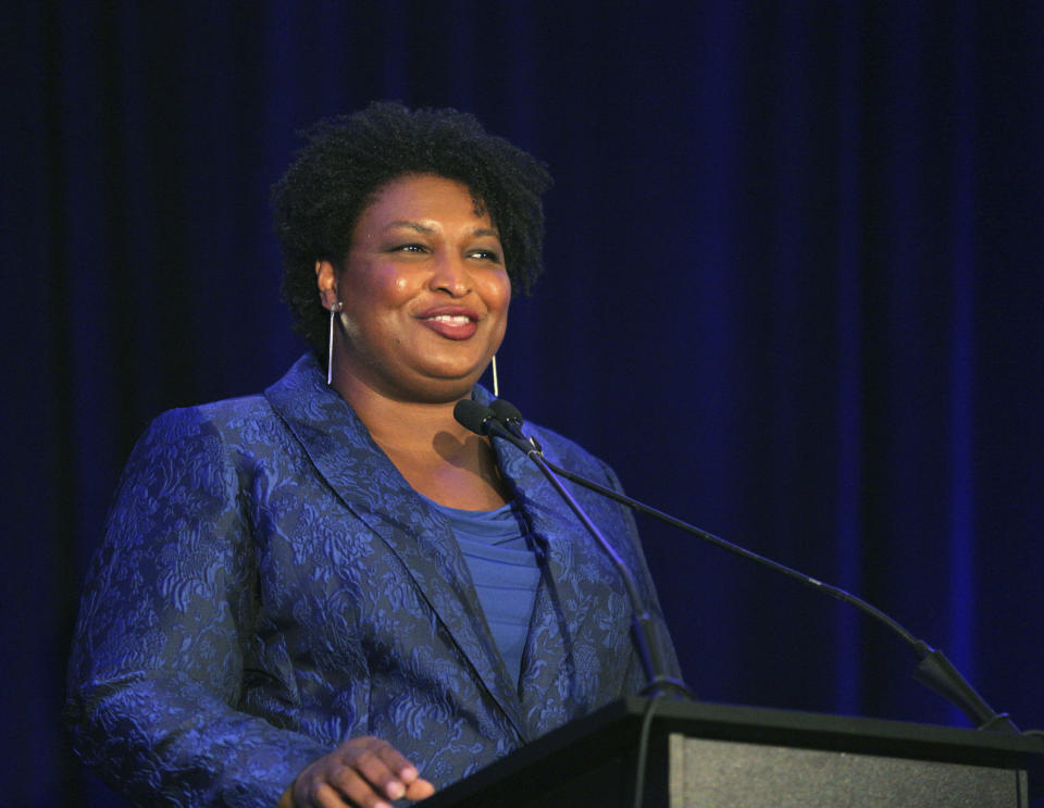 Stacey Abrams addresses the Gwinnett County Democratic Party fundraiser on Saturday, May 21, 2022, in Norcross, Ga. (AP Photo/Akili-Casundria Ramsess)