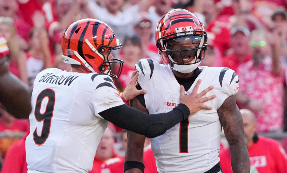 Sep 15, 2024; Kansas City, Missouri, USA; Cincinnati Bengals quarterback Joe Burrow (9) restrains wide receiver Ja'Marr Chase (1) after an altercation with officials during the second half of the game against the Kansas City Chiefs at GEHA Field at Arrowhead Stadium. Mandatory Credit: Denny Medley-Imagn Images