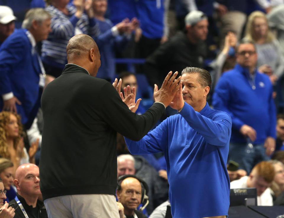 Kentucky’s John Calipari and Louisville’s Kenny Payne hug each other at the end of the game.Dec. 31, 2022