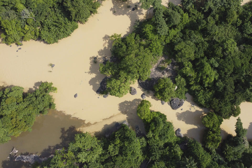 The Osun River flows through the forest of the Osun-Osogbo Sacred Grove, designated a UNESCO World Heritage Site in 2005, in Osogbo, Nigeria, on Monday, May 30, 2022. (AP Photo/Lekan Oyekanmi)