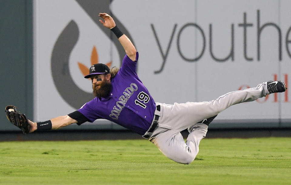 Colorado Rockies center fielder Charlie Blackmon catches a ball hit by Los Angeles Angels' David Fletcher during the first inning of a baseball game Monday, Aug. 27, 2018, in Anaheim, Calif. (AP Photo/Mark J. Terrill)