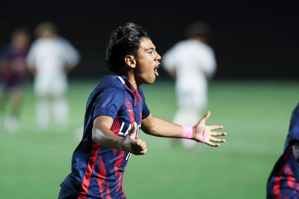 Lafayette’s Alecx Castro (11) celebrated scoring a penalty kick against Henry Clay during boys high school soccer’s 11th Region Tournament semifinals at Great Crossing High School on Thursday.