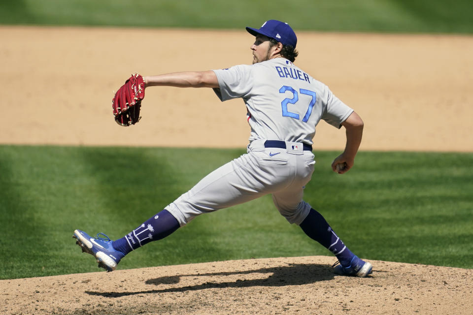 Los Angeles Dodgers pitcher Trevor Bauer (27) throws against the Oakland Athletics during the fifth inning of a baseball game in Oakland, Calif., Wednesday, April 7, 2021. (AP Photo/Jeff Chiu)