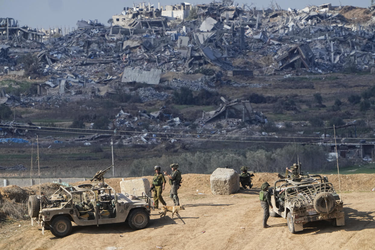 FILE - Israeli soldiers take up positions near the Gaza Strip border, in southern Israel, Friday, Dec. 29, 2023. The army is battling Palestinian militants across Gaza in the war ignited by Hamas' Oct. 7 attack into Israel. (AP Photo/Ariel Schalit, File)