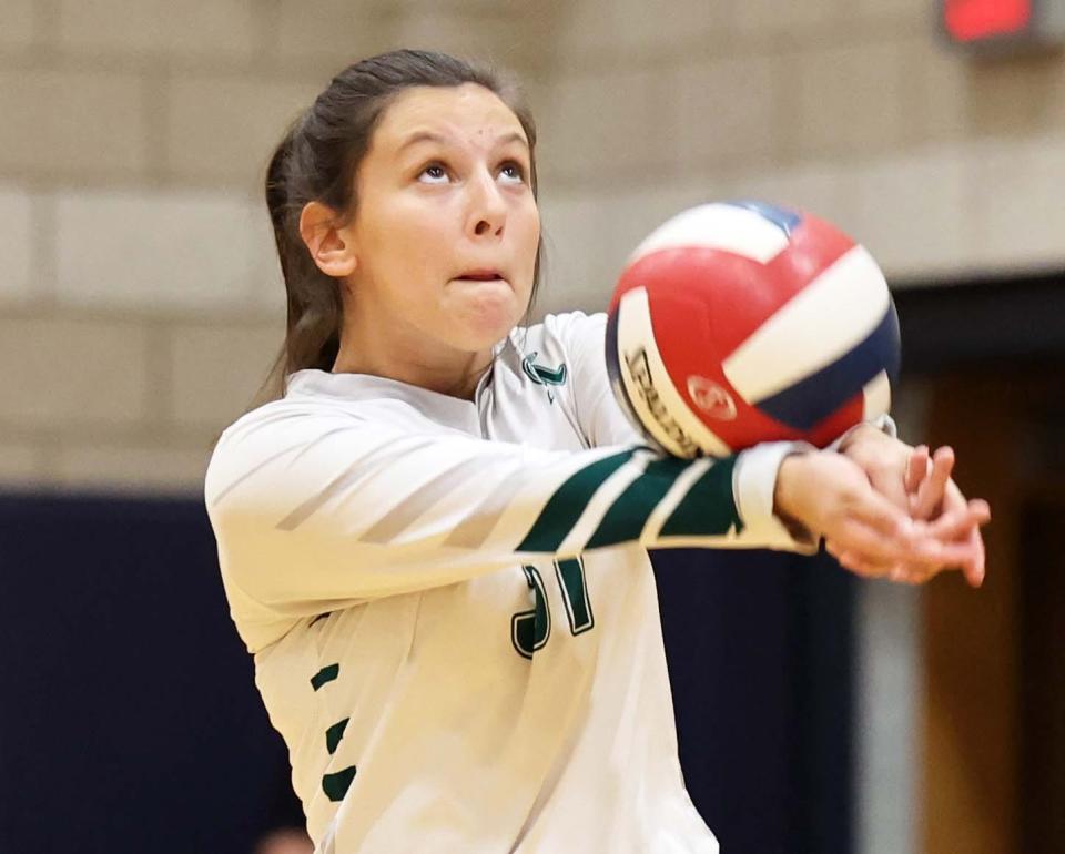 Abington's Madison Perry sets the volleyball during a game versus East Bridgewater on Wednesday, Oct. 13, 2022.