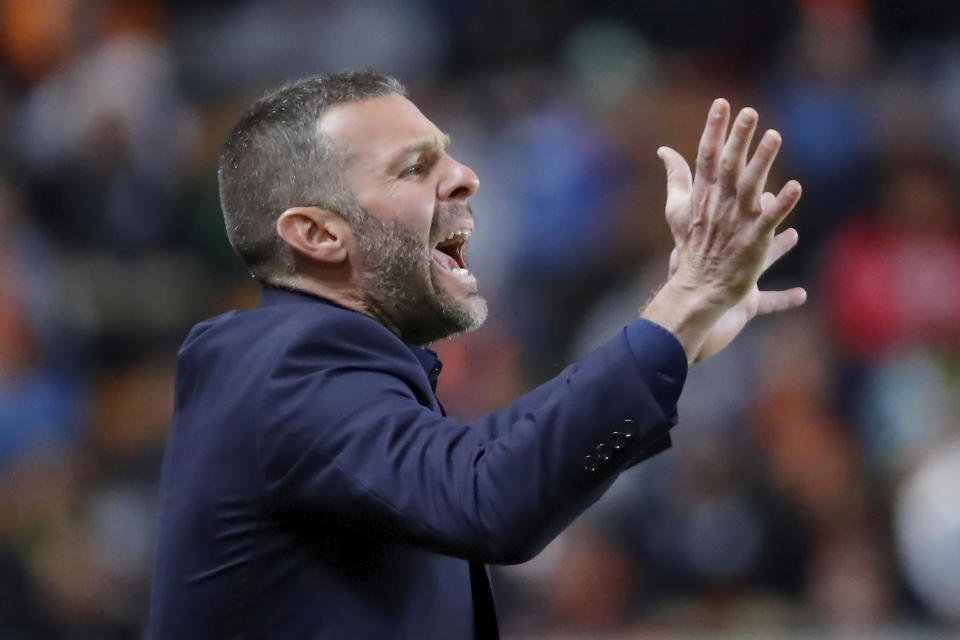 Houston Dynamo head coach Ben Olsen yells to players during the first half of the team's MLS soccer match against Austin FC on Saturday, March 18, 2023, in Houston. (AP Photo/Michael Wyke)