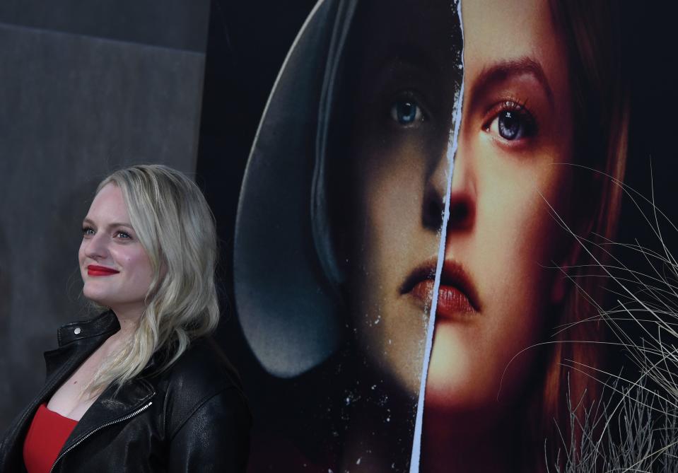 Elisabeth Moss arrives for the season 2 premiere of Hulu's 'The Handmaid's Tale' at the TCL Chinese Theatre in Hollywood, California on April 19, 2018. (Photo by Mark RALSTON / AFP)        (Photo credit should read MARK RALSTON/AFP/Getty Images)