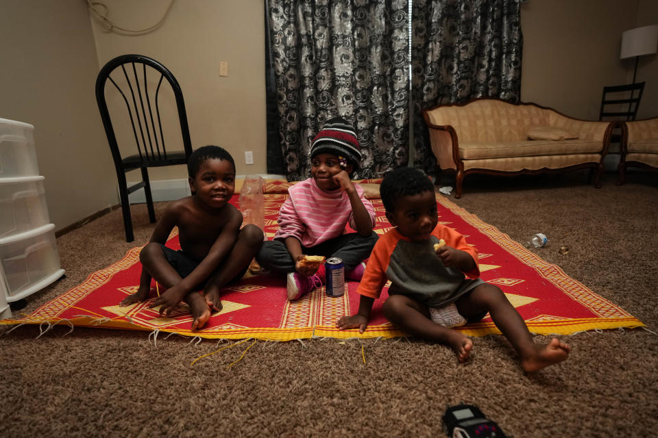 Mkenja Ilanga, Mawazo Ilanga, and Bahome Ilanga in their home at Hickman Loft Apartments.