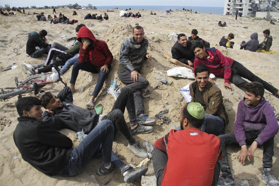 Palestinians wait for the humanitarian aid to be dropped by the U.S. Air Force in Gaza City, Gaza Strip, on Saturday, March 9, 2024. (AP Photo/Mahmoud Essa)