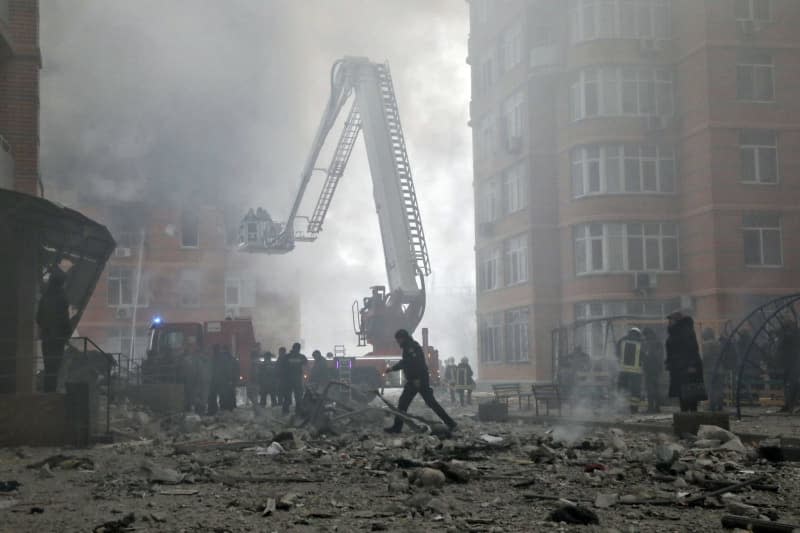 Firefighters extinguish a fire at a residential building affected by the massive Russian missile and drone attack in Odessa, southern Ukraine. -/Ukrinform/dpa
