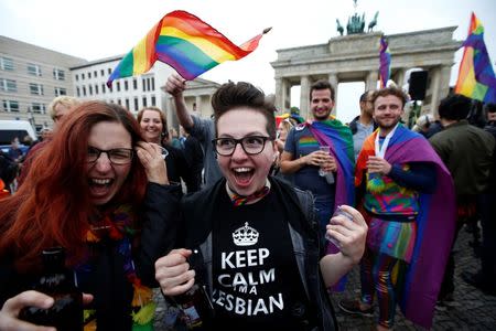 People celebrate Germany's parliament legalising the same-sex marriage in front of the Brandenburg Gate in Berlin, Germany June 30, 2017. REUTERS/Fabrizio Bensch