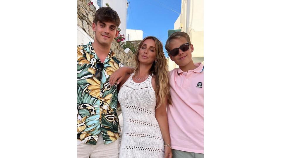 Louise smiling alongside sons Charley and Beau 