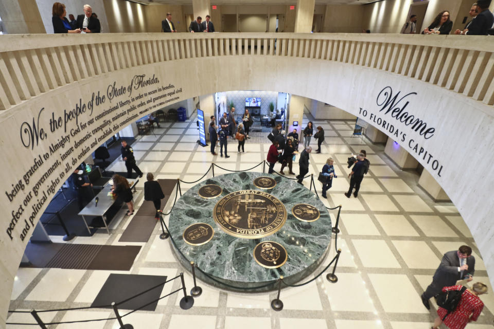 The Florida Capitol rotunda is abuzz with people during the Special Session Wednesday, Feb. 8, 2023 in Tallahassee, Fla. (AP Photo/Phil Sears)