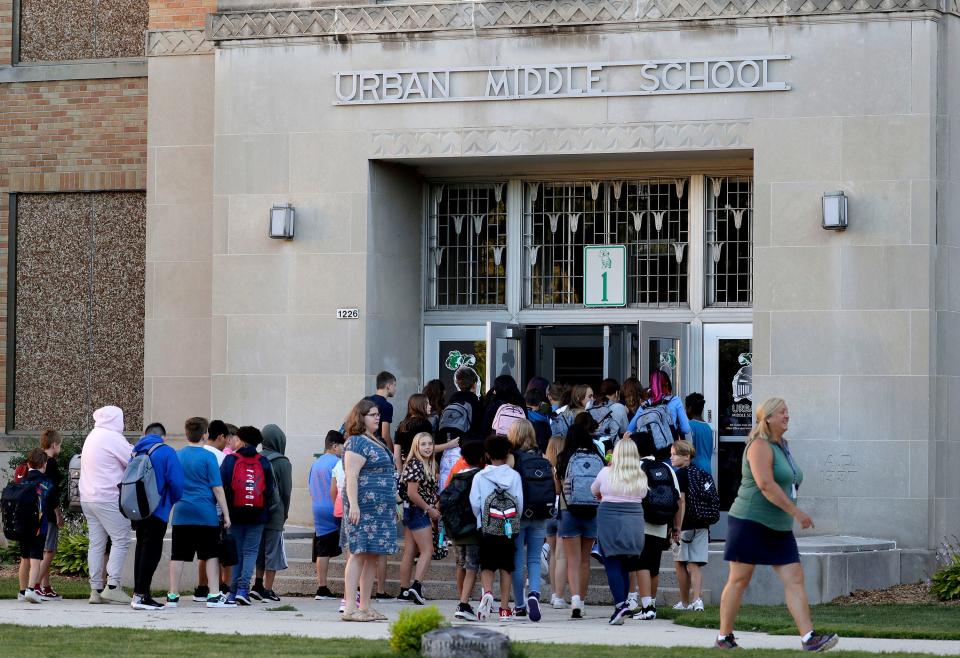Students enter Urban Middle School on the first day of classes, Thursday, September 1, 2022, in Sheboygan, Wis.