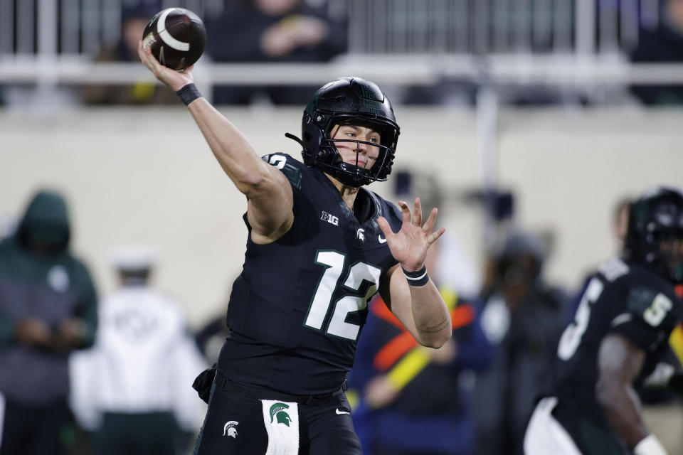 Michigan State quarterback Katin Houser looks to throw a pass during the first half of an NCAA college football game against Michigan, Saturday, Oct. 21, 2023, in East Lansing, Mich. (AP Photo/Al Goldis)