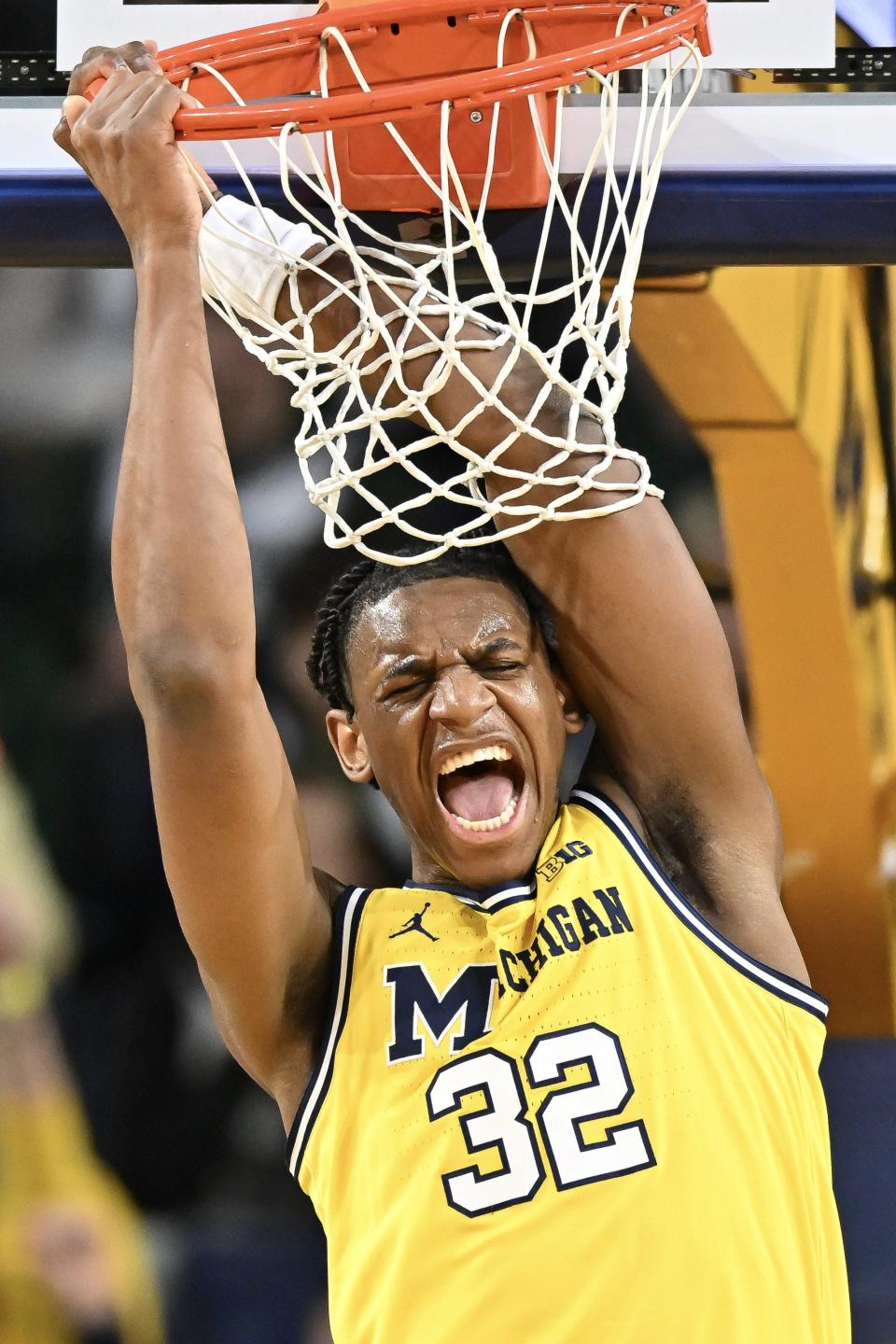 Tarris Reed Jr. of the Michigan Wolverines reacts after a dunk against the Michigan State Spartans in the second half at Crisler Center in Ann Arbor on Saturday, Feb. 17, 2024.