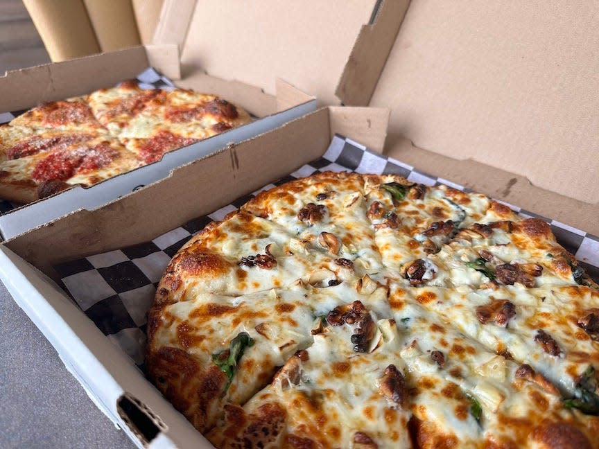 The Bees Knees, front, and the Old World specialty pizzas from Prohibition Pizza in High Springs.