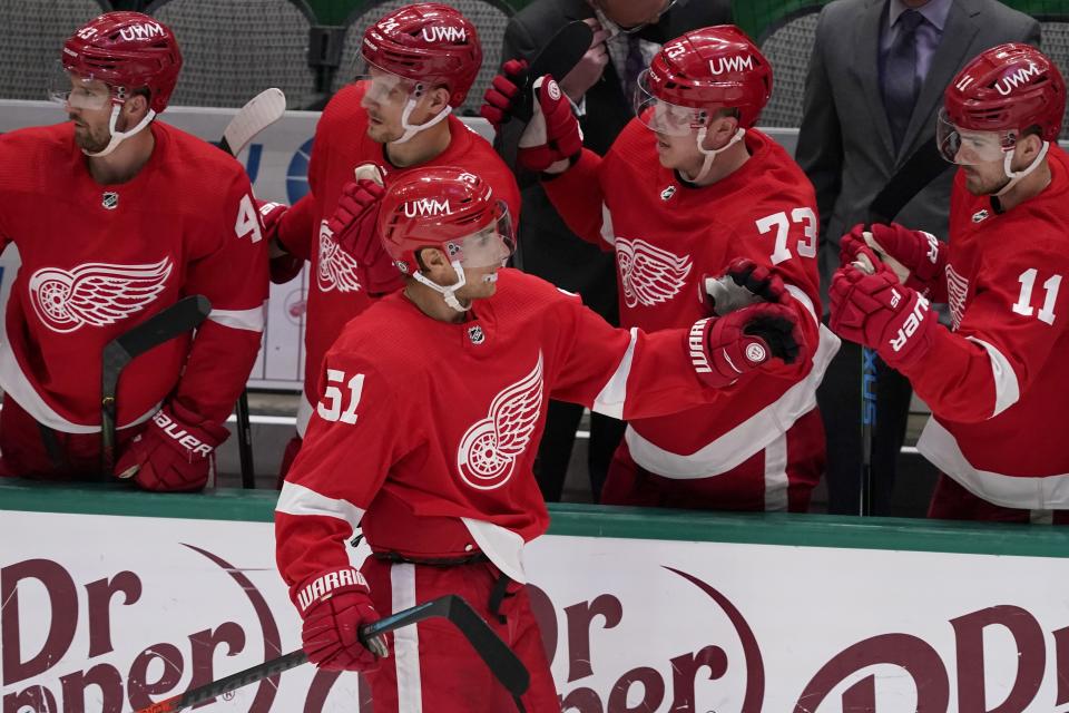 Detroit Red Wings center Valtteri Filppula (51) is congratulated by Darren Helm (43), Richard Panik (24), Adam Erne (73) and Filip Zadina (11) after scoring against the Dallas Stars in the second period of an NHL hockey game in Dallas, Tuesday, April 20, 2021. (AP Photo/Tony Gutierrez)