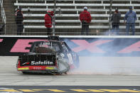 NASCAR Texas Trucks Series driver Christian Eckes (18) skids out on the front stretch after contact from another vehicle during an auto race at Texas Motor Speedway in Fort Worth, Texas, Sunday, Oct. 25, 2020. (AP Photo/Richard W. Rodriguez)