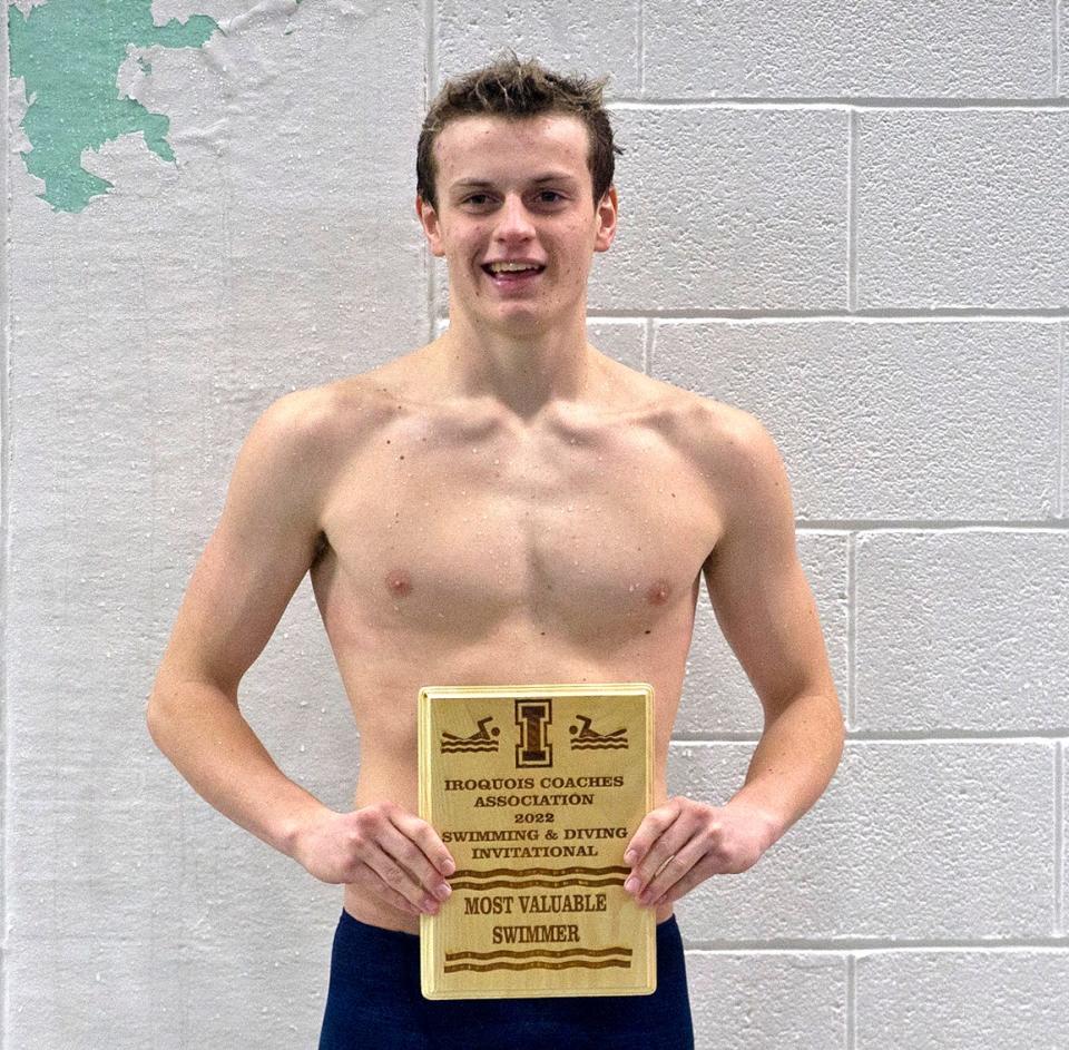 Sharon High School's Mark Cattron poses with his Most Valuable Swimmer plaque on Saturday.