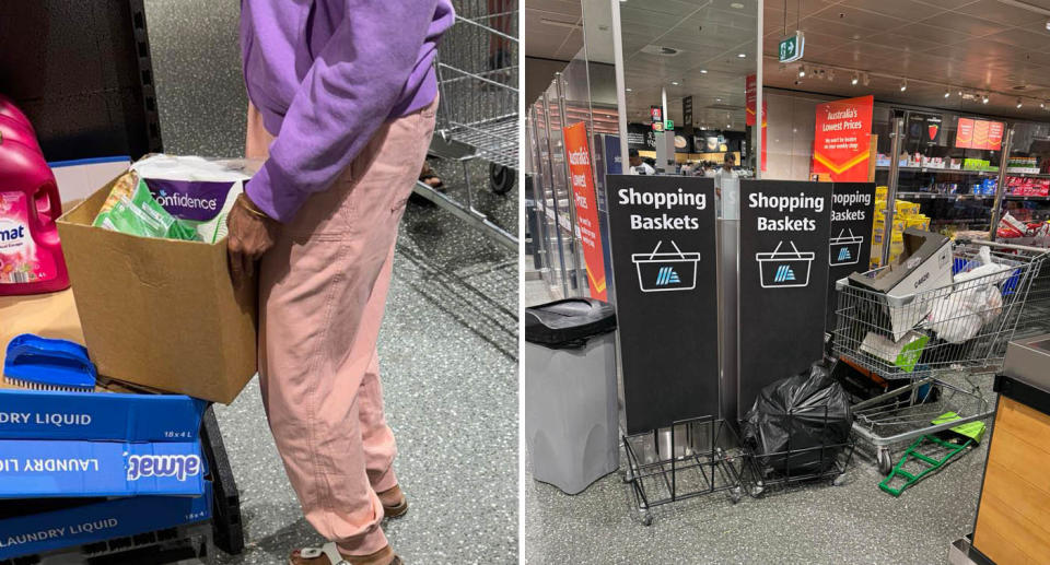 A woman holds a box containing groceries (left) while a row of shopping basket stands lay empty (right). 