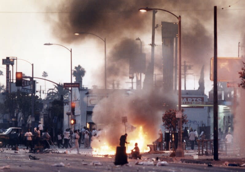 Rioters at the corner of Florence and Normandie avenues the first day of civil unrest 4/29/1992. Kirk McKoy / Los Angeles Times