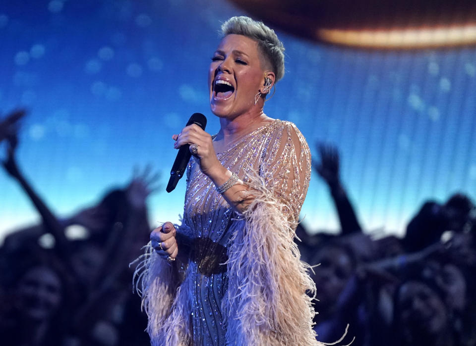 FILE - Pink performs at the American Music Awards in Los Angeles on Nov. 20, 2022. At a Pink concert recently, a fan tossed their mother’s ashes onto the stage as she was performing. (AP Photo/Chris Pizzello, File)