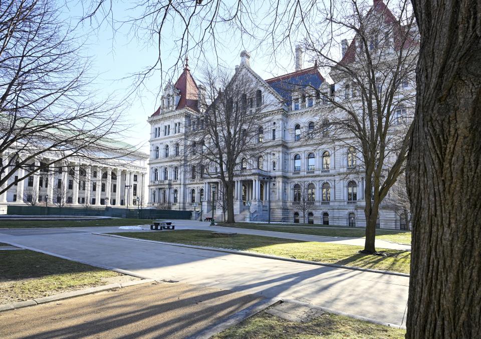 The New York State Education Department Building ,left, and Capitol are seen before Gov. Kathy Hochul presents her executive state budget Wednesday, Feb. 1, 2023, in Albany, N.Y. (AP Photo/Hans Pennink)