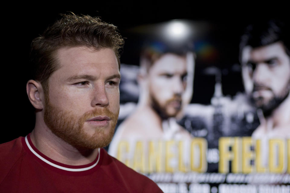 Canelo Alvarez is interviewed, Tuesday, Oct. 16, 2018, in New York. Alvarez is scheduled to fight WBA super middleweight boxing champion Rocky Fielding in New York in December. (AP Photo/Mark Lennihan)