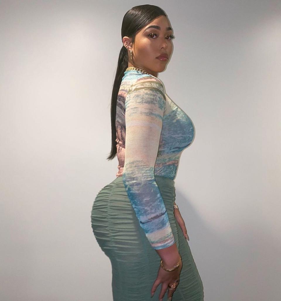 Jordyn Woods poses in a bodysuit