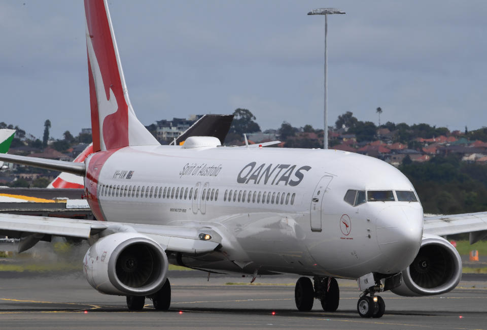 SYDNEY, AUSTRALIA - MARCH 17: Qantas aircraft on the runway at Sydney Airport on March 17, 2020 in Sydney, Australia. Qantas and Jetstar will cancel almost all international flights as well as cutting domestic flights until May as travel demand collapses due to the COVID-19 pandemic. The Australian Government introduced strict border security measures on Monday, requiring all overseas arrivals to self-isolate for 14 days in a bid to stem the spread of coronavirus. The number of confirmed COVID-19 cases is now at 379 in Australia, with five deaths. (Photo by James D. Morgan/Getty Images)