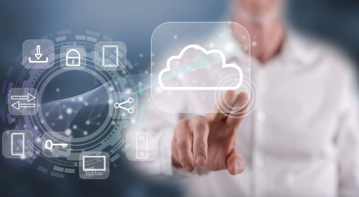 a man taps a digital image of a cloud with his finger