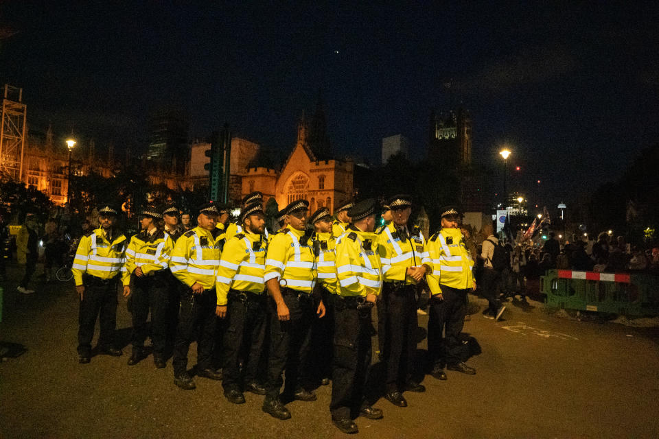 Police prepare to control the protesters and clear traffic from Parliament Square where hundreds of people had gathered to protest against Boris Johnson