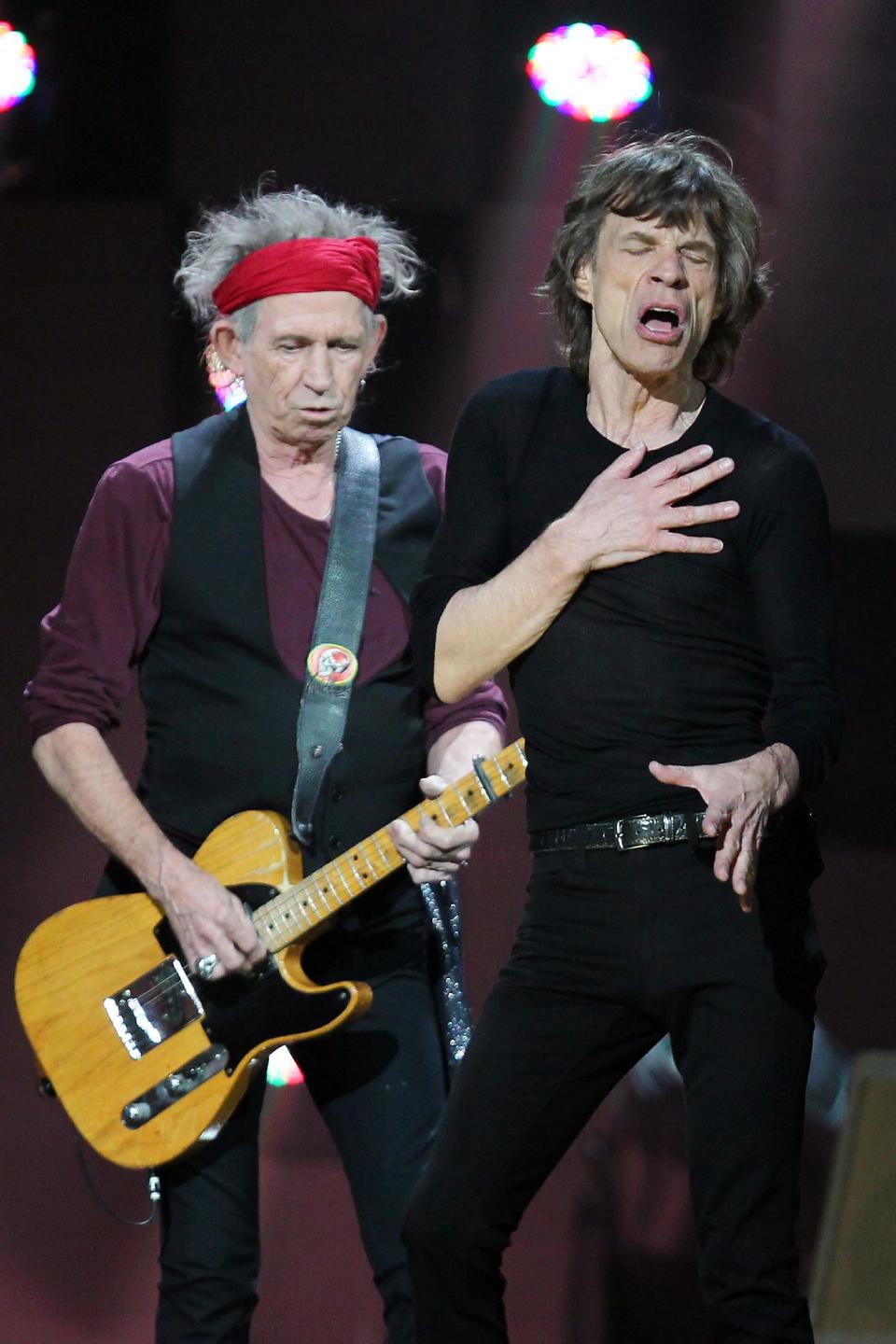 In this image released by Starpix, Keith Richards, left, and Mick Jagger of The Rolling Stones perform at 12-12-12 The Concert for Sandy Relief at Madison Square Garden in New York on Wednesday, Dec. 12, 2012. Proceeds from the show will be distributed through the Robin Hood Foundation. (AP Photo/Starpix, Dave Allocca)