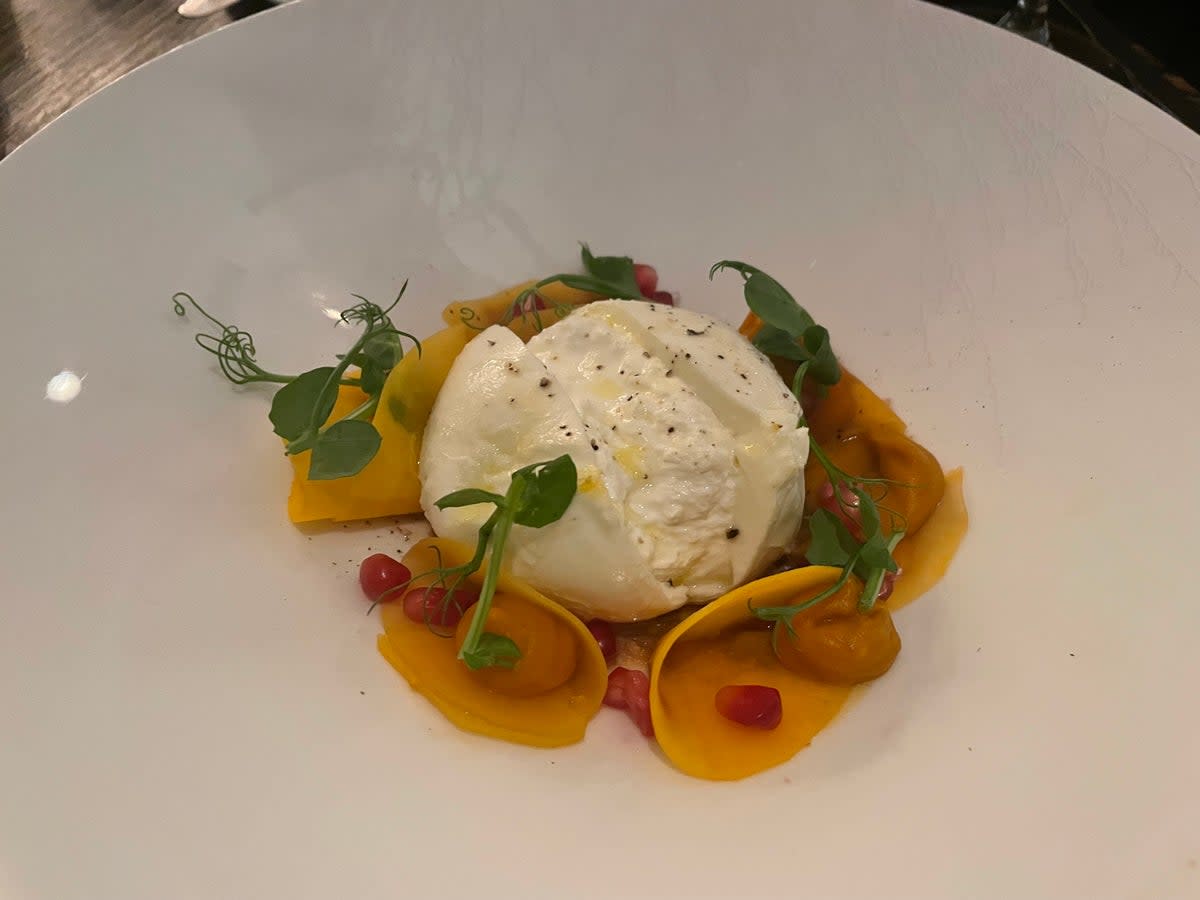 A burrata and tomato salad catches our eye, a combination that can do no wrong, if you don’t think about the carbon footprint of burrata for too long (Kate Ng)