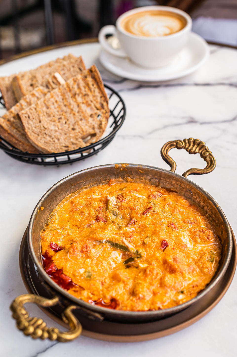 Traditional turkish menemen with eggs, sausage sucuk and tomatoes.