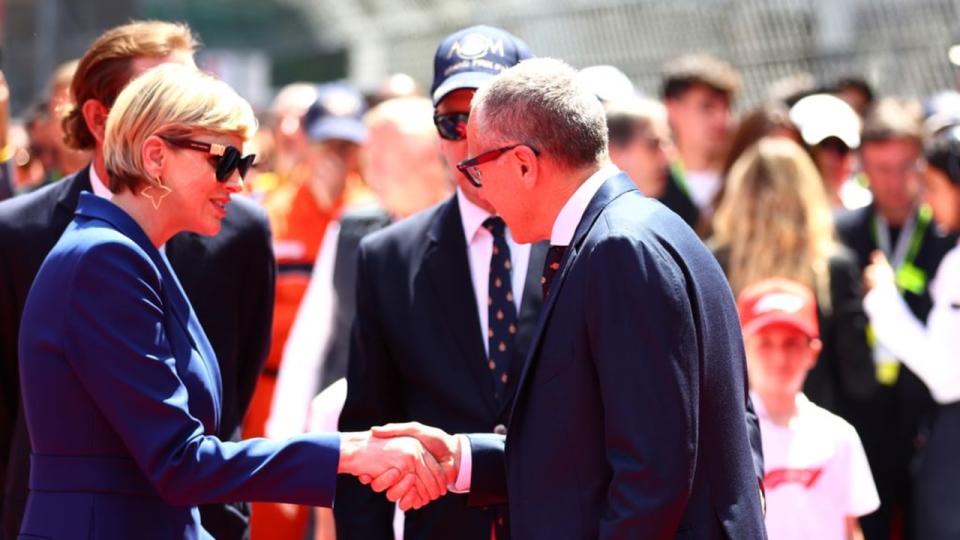 Stefano Domenicali, CEO of the Formula One Group, shakes hands with Princess Charlene prior to the F1 Grand Prix of Monaco 