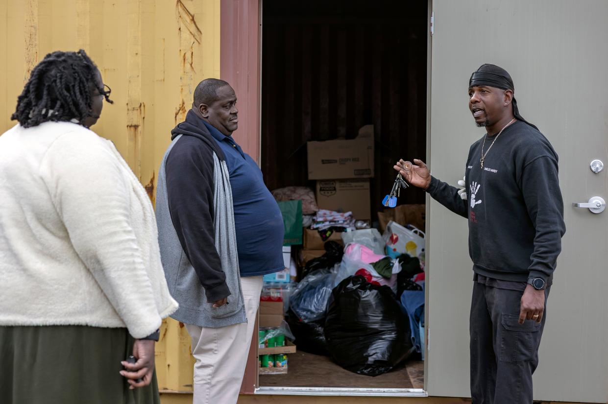 FILE - Charles Hardy, president of Athens Alliance, shows Charetta Milton, project director, and Charles Campbell, head of security, the piles of donations waiting to be distributed to incoming residents of the government-sanctioned encampment, called “First Step,” on Wednesday, Feb. 16, 2022 in Athens. Hardy was arrested following an altercation at the camp on Aug. 29, 2022, with a homeless woman, said Athens-Clarke County police.